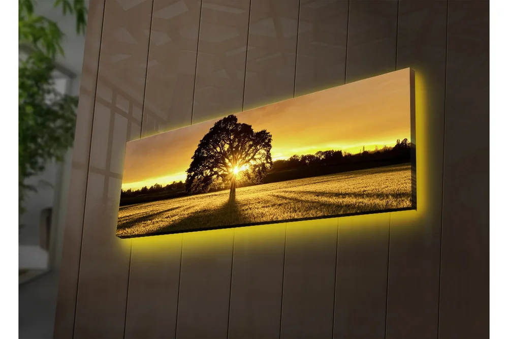 Lerretsbilde med LED-belysning 30x90 cm - Silhuett av et tre mot en gyllen solnedgang v:9079703